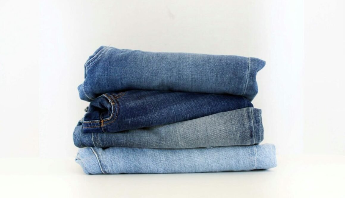 Stack of jeans photographed by Claire Abdo